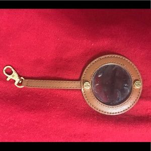 Tory Burch inside purse mirror.